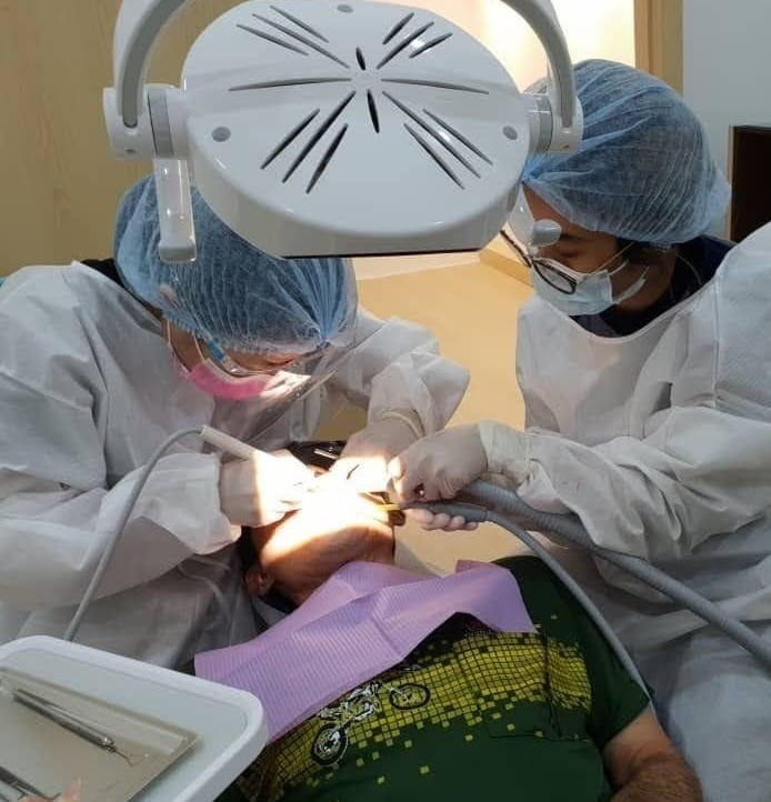 dr chun doing treatment in chun dental clinic