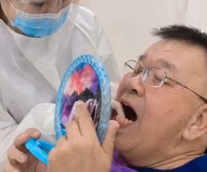 dr chun is explaining post operative instruction to pateint with mirror